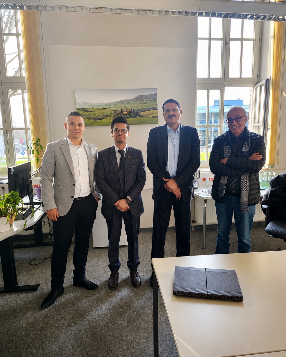 Rohit Nayar with colleagues in the office after an interpreting assignment
